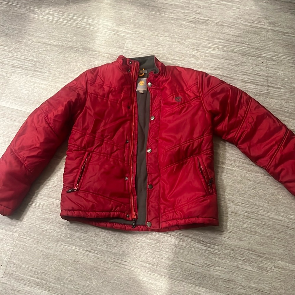 Red quilted winter jacket.